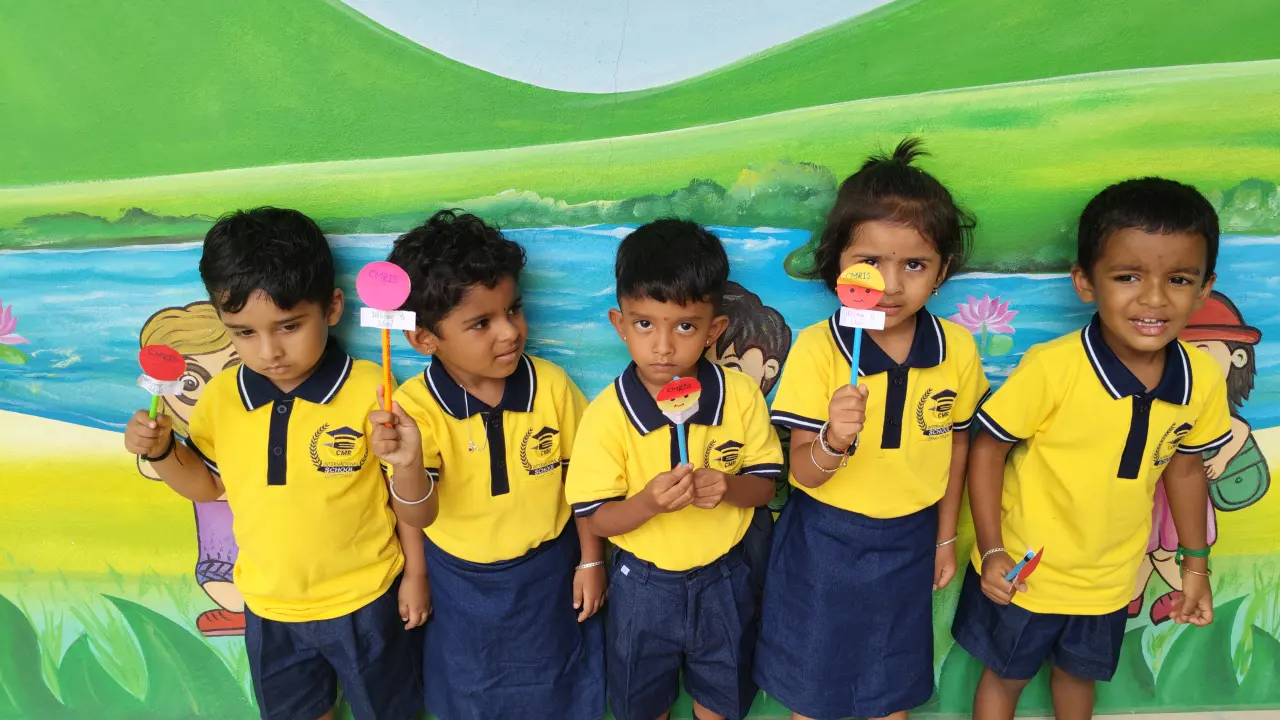Children with their teacher at CMR International School